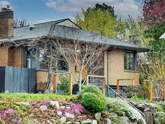 This beautiful yard is about 1 month away from blooming with color and fragrance. There is an irrigation system in the front and back yards for easy maintenance.