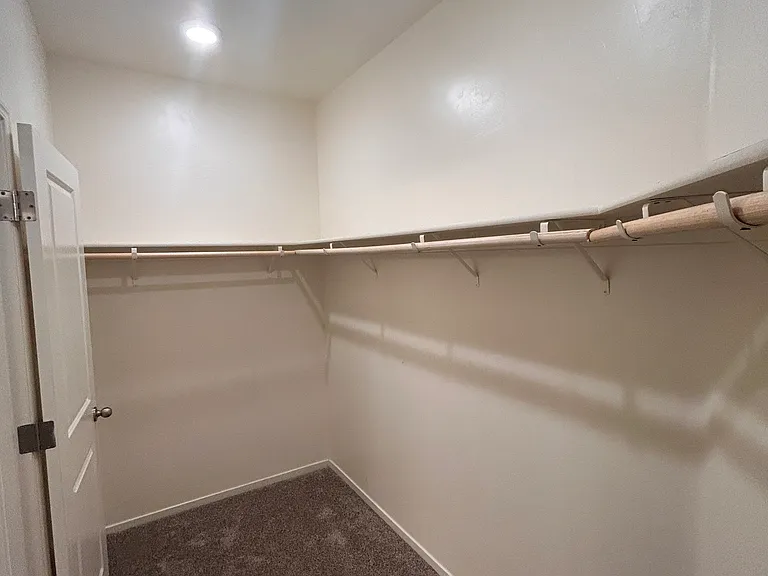oversized walk-in closet in master bedroom