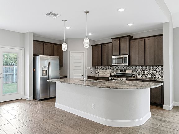 Kitchen has 4 bar stools not included in picture.