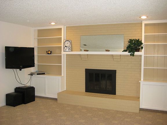 Family rm with fireplace and new paint and carpet