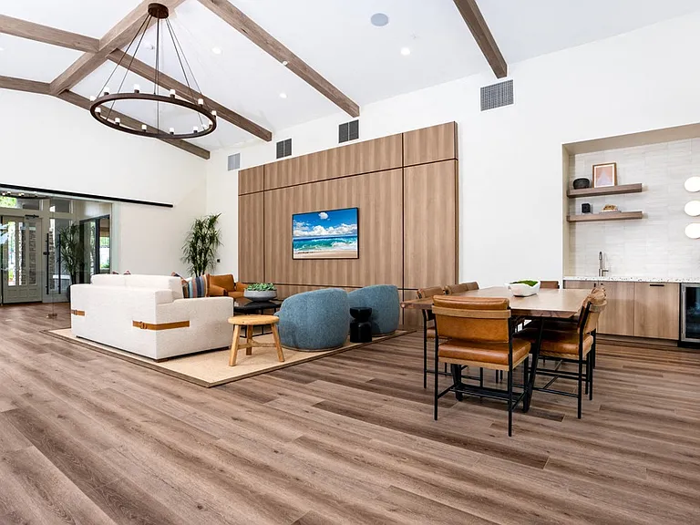 Spacious Resident Lounge with Dining Table, TV Lounge, and Kitchenette Area