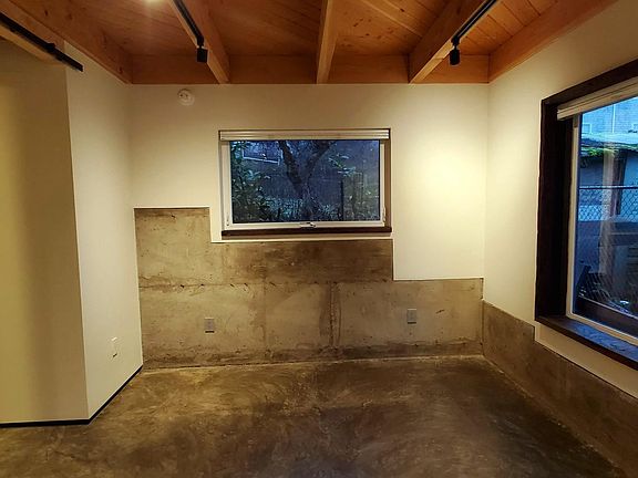 Bedroom w/ bottom-up/top-down blinds for lots of light and privacy.