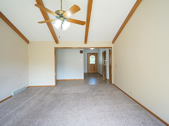 Spacious high ceiling living room with new paint throughout