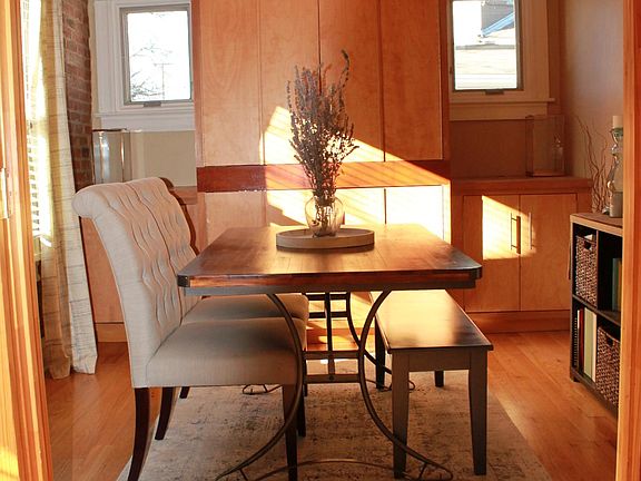Second bedroom, currently being used as a dining room. 10'x10' (not counting built-in armoire/cabinets).