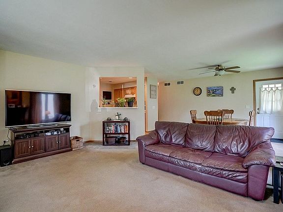 Kitchen opens to living room and dining room