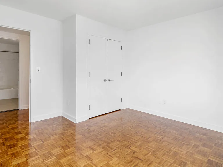 Bedroom with Wood Parquet Flooring
