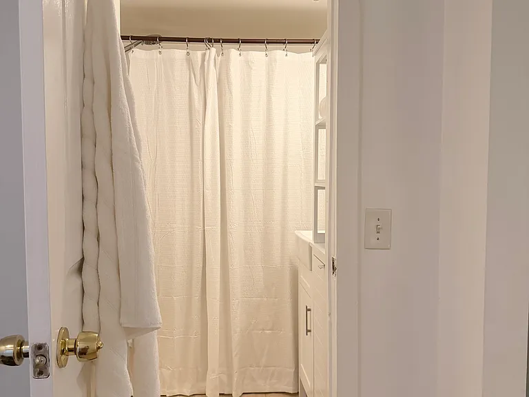 Bathroom with full bath.