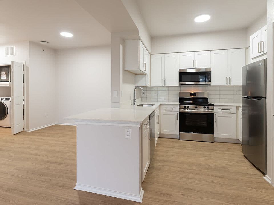 Kitchen with island and hard surface
