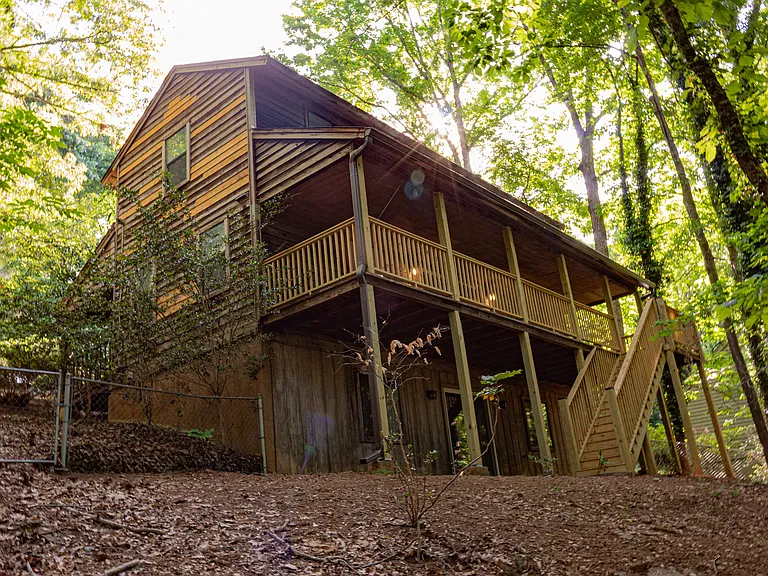 And here's the full back side of the house. It will take some time for the new cedar panels on the sides of the house to weather to the same degree as the original ones.