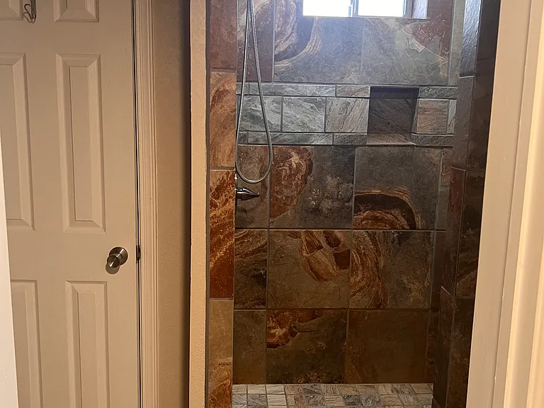 second bathroom with view of shower