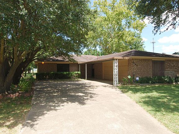 Extra long with drive way with side swing garage.