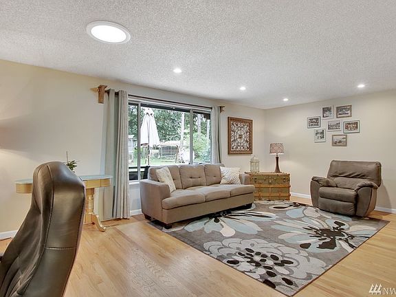 Spacious living area with gorgeous refinished hardwood floors, and even room for an office area.