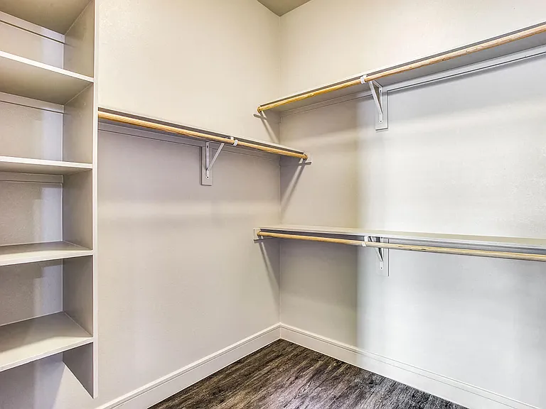 Oversized walk-in closets with built-in shelves