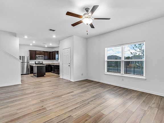 Open layout of the main floor with a large living room and chef-ready kitchen.