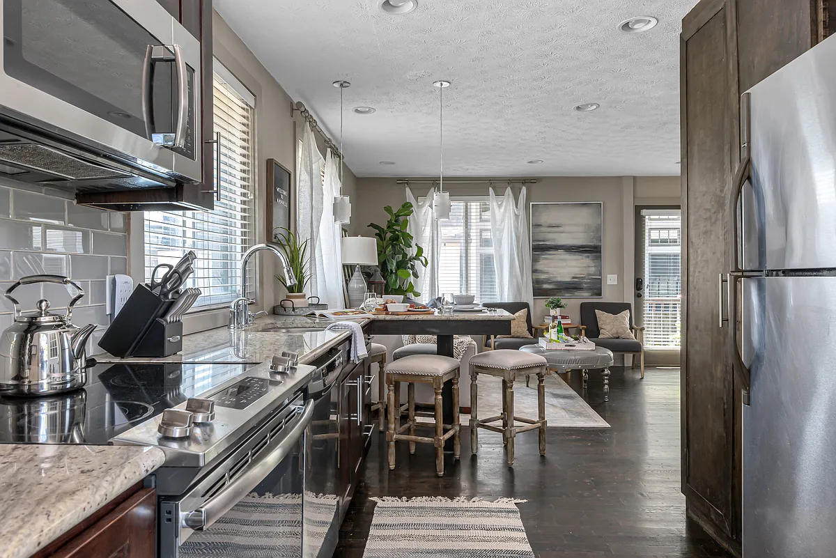 Kitchen has all stainless steel appliances. - 1713 6th Ave N #A