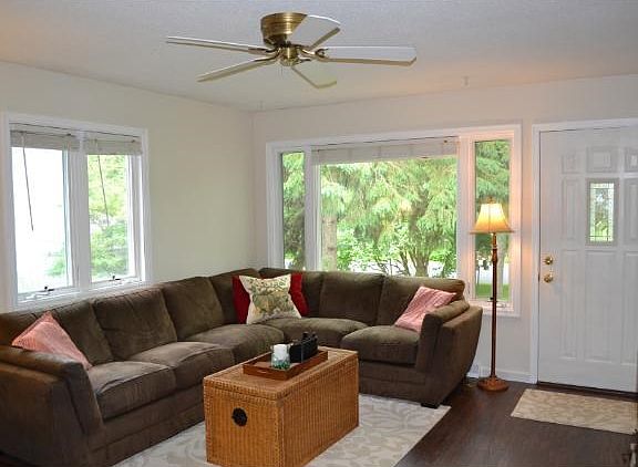 The living room has been updated with new engineered flooring, paint and windows were replaced at on