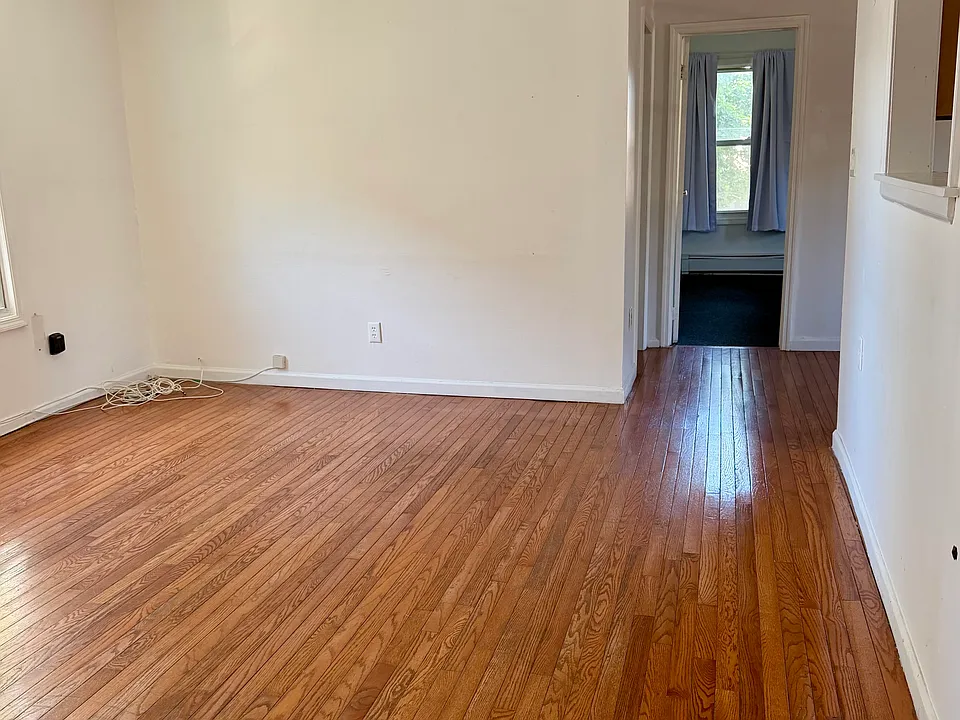 Living room as you enter with bathroom to the right.