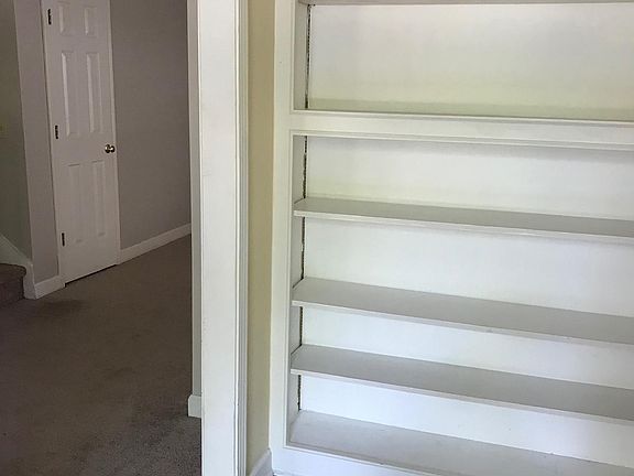 Foyer with built-in bookcase