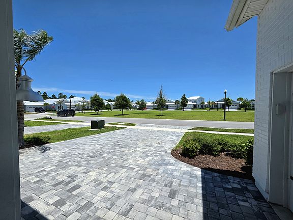 View from the front door: across from Dorado's park, offering extra privacy. Home located on street looped around the park, which gives a calmer street feel with minimal through-traffic.