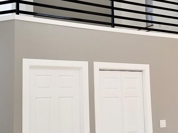 Half bathroom and laundry units below mezzanine.