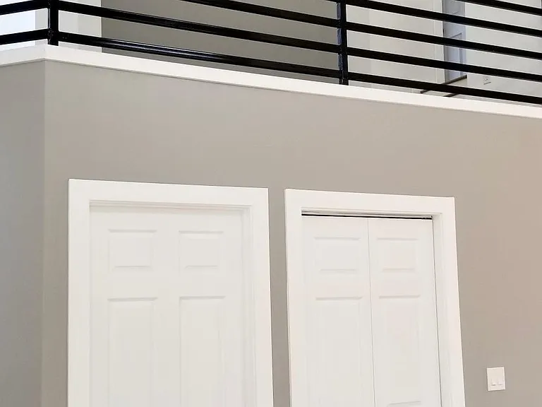 Half bathroom and laundry units below mezzanine.