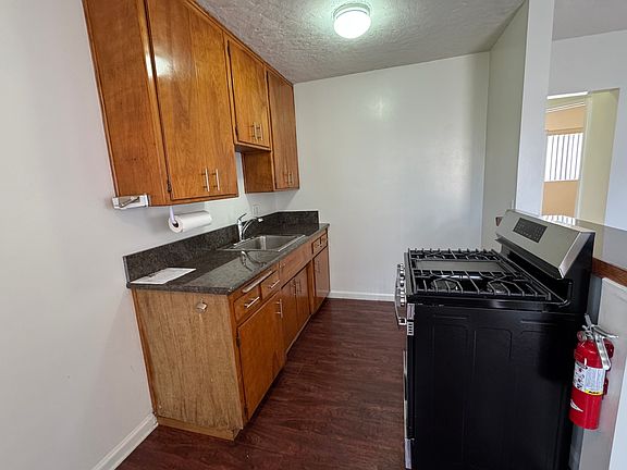 Nice kitchen with granite countertops. You provide refrigerator.