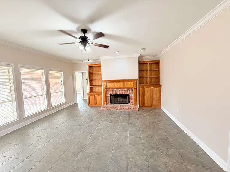 Extra Large Den with Real Wood Burning Fireplace. Updated Tile flooring - Plenty of light