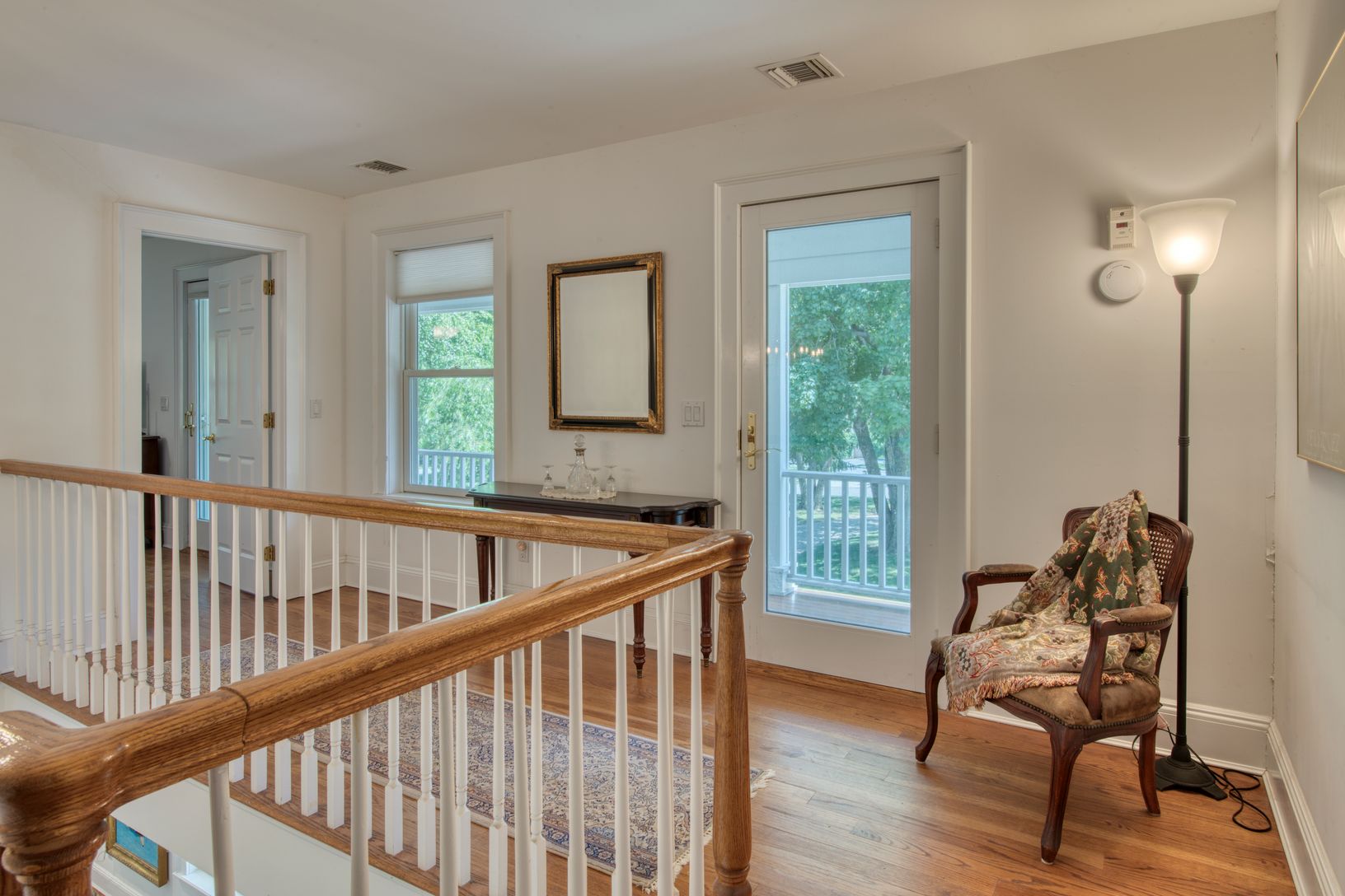 Second floor landing with covered porch