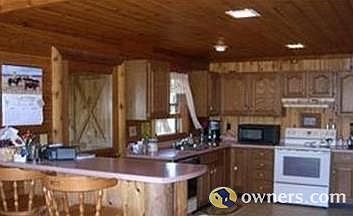 Kitchen and brkfst.bar in main home