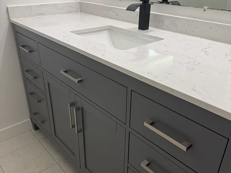 Brand new tile floors, vanity, sink, faucet and luxurious marble countertop