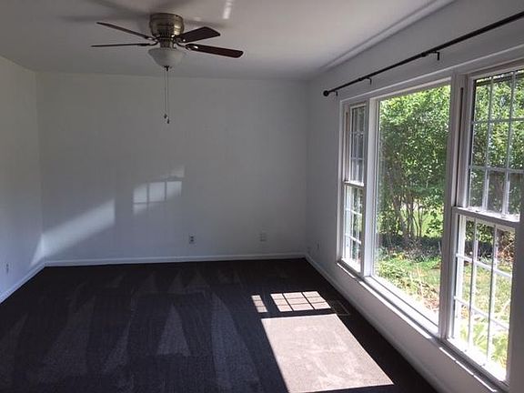 Light filled Living Room with Ceiling Fan