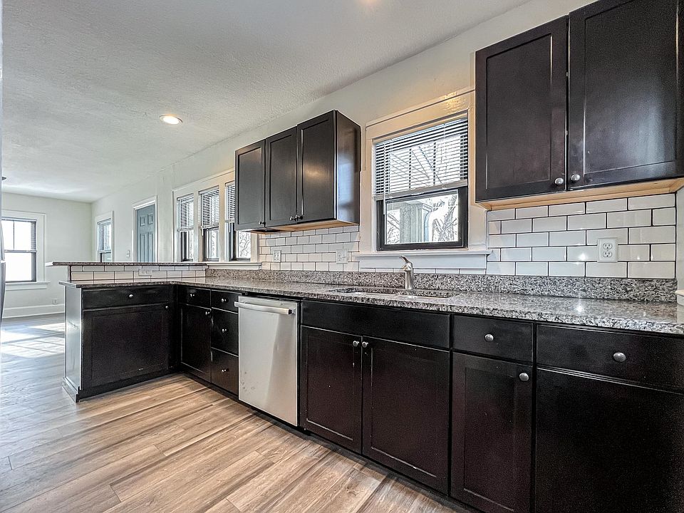 Newly renovated kitchen with stainless steel appliances, subway tiled backsplash, and plenty of cabinet space.