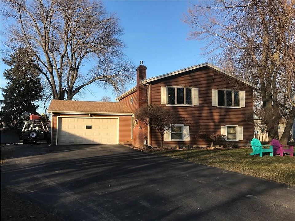 EXTERIOR FRONT-2 CAR GARAGE, DOUBLE WIDE DRIVEWAY AND PARKING AREA
