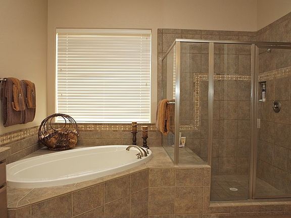 Upgraded Master Bath with beautiful tile and drop in tub