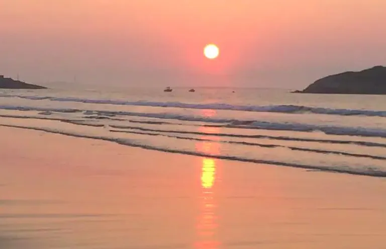 Sunrise over Good Harbor - a morning walk away.