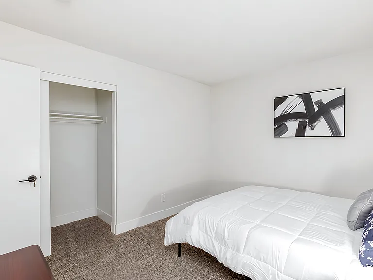 Bedroom, nightstand, full closet, and dresser
