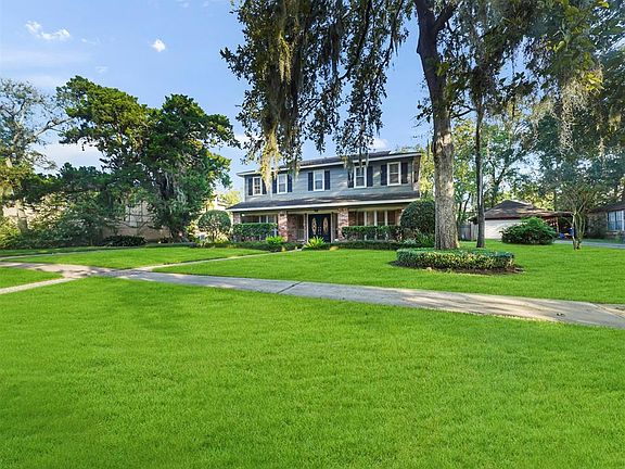 BEAUTIFUL OVERSIZED LOT WITH MATURE TREE'S AND LUSH LANDSCAPING