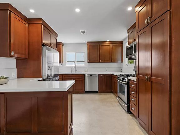Generous sunlit kitchen with high end appliances