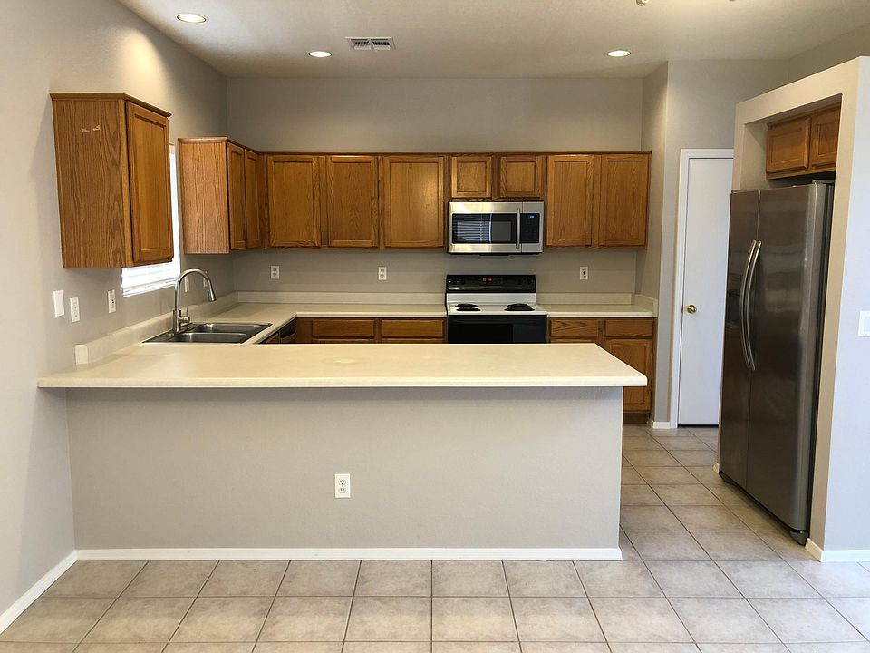 Kitchen; new refrigerator, new dishwasher, new microwave, new faucet, stainless steel double bay sink, lots of cabinet space