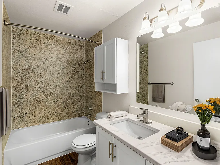 Experience tranquility in this chic and modern bathroom, designed for ultimate relaxation.