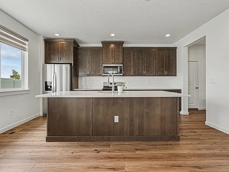 Kitchen with Gas Stove, Oven, Microwave and Refrigerator