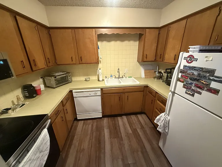Kitchen with new stove and microwave