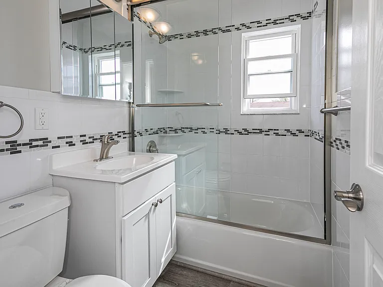 Renovated bathrooms with glass shower doors
