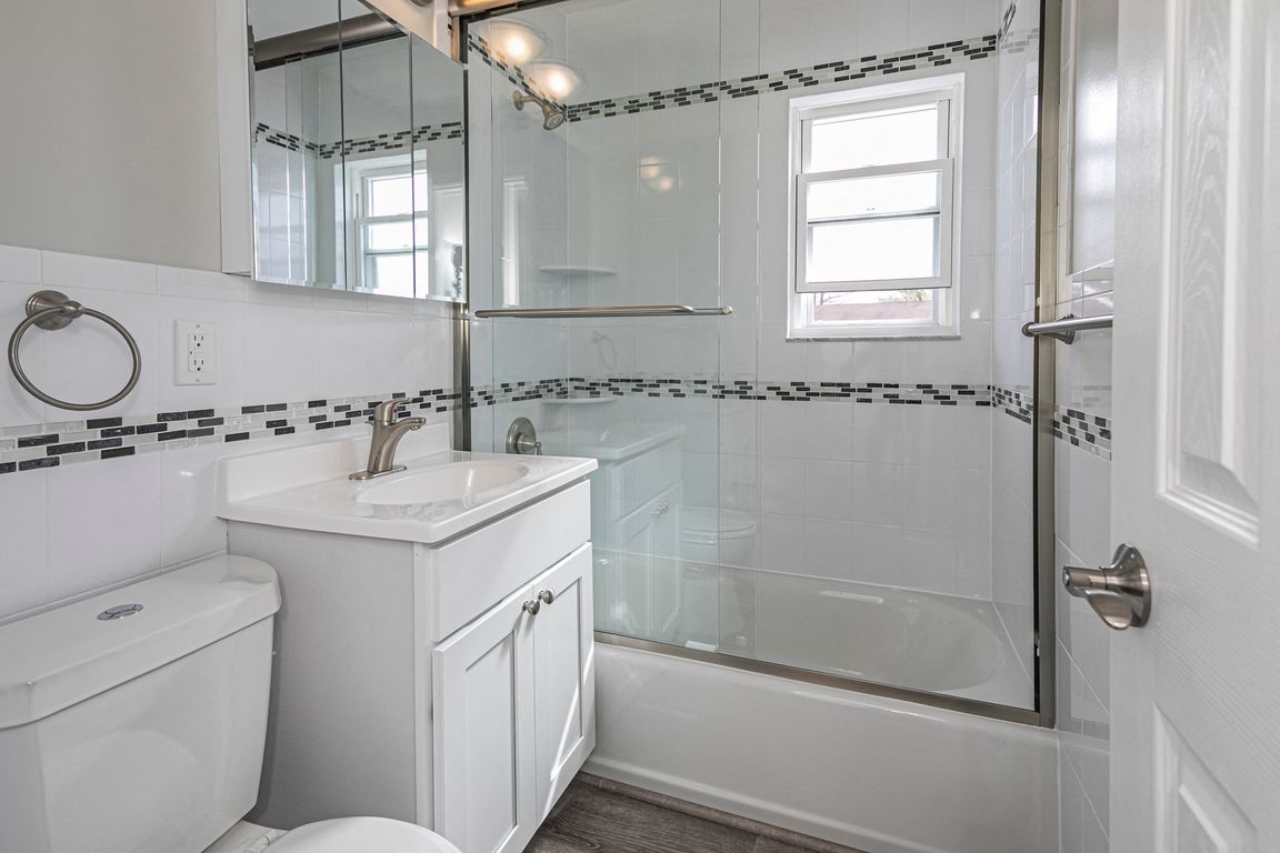 Renovated bathrooms with glass shower doors