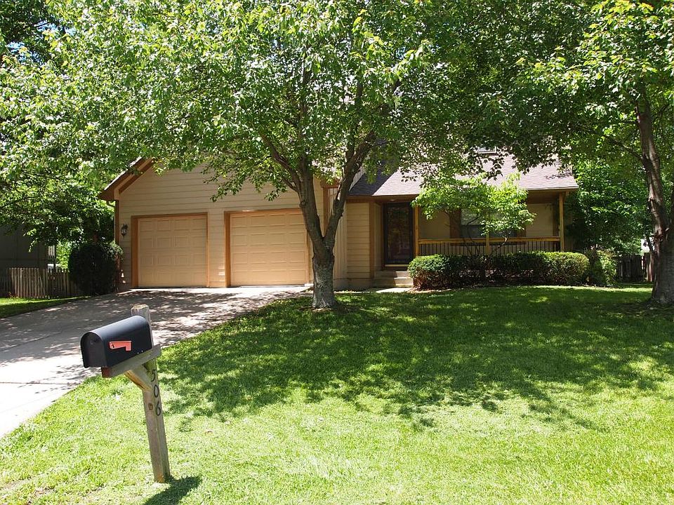Front of house with large porch.