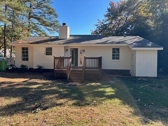 Rear Elevation/View of Deck and Storage Building