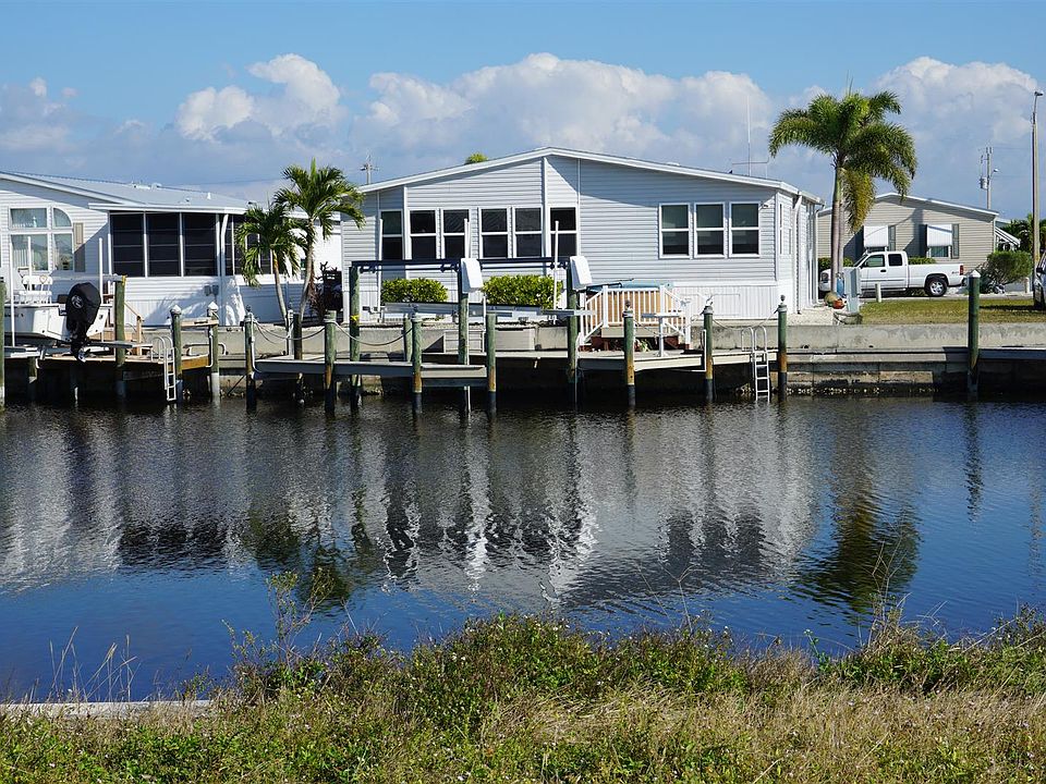 Wide waterfront view with dock & boat lift