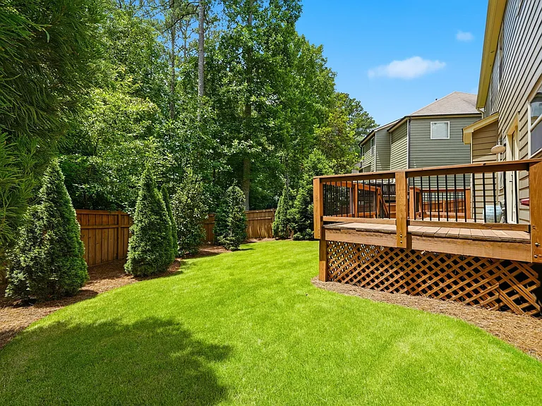 Private fenced yard with large deck for entertaining
