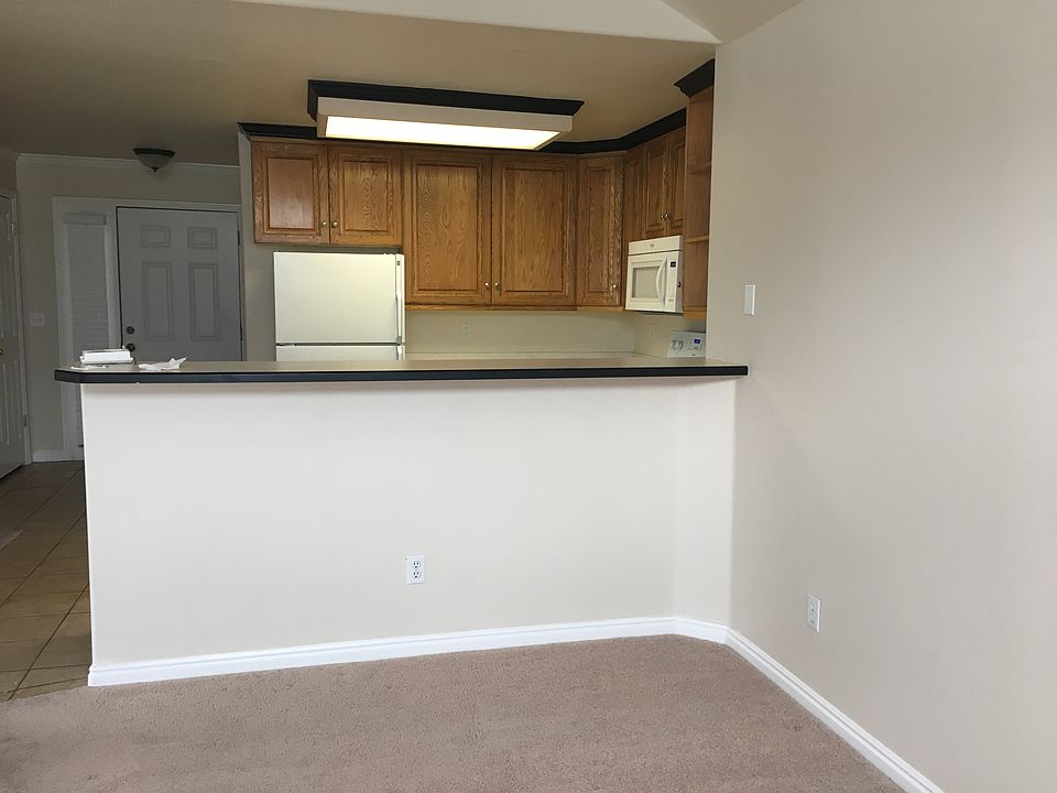 Looking into kitchen and bar area from living room