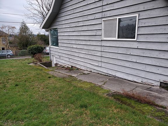 side of the house & exterior entrance to the basement